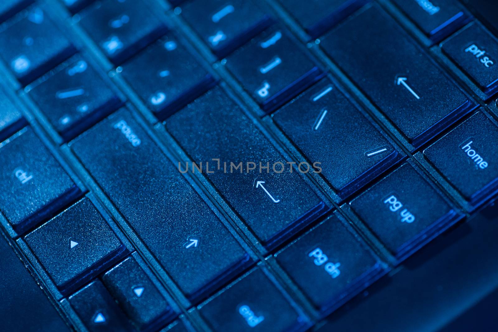 part of the black notebook keyboard on table