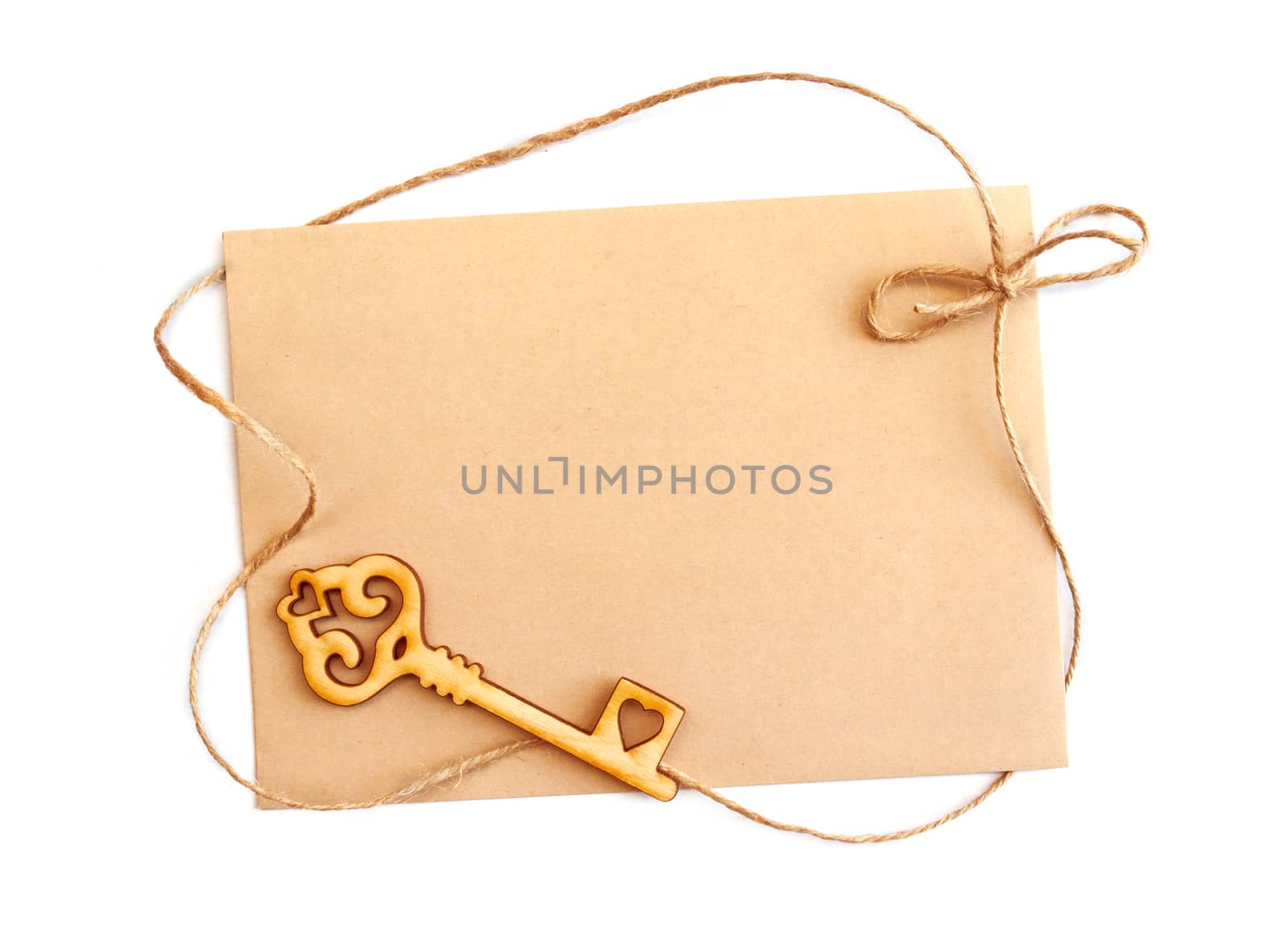 sheet of kraft paper with key and rope to the frame and place for text.
