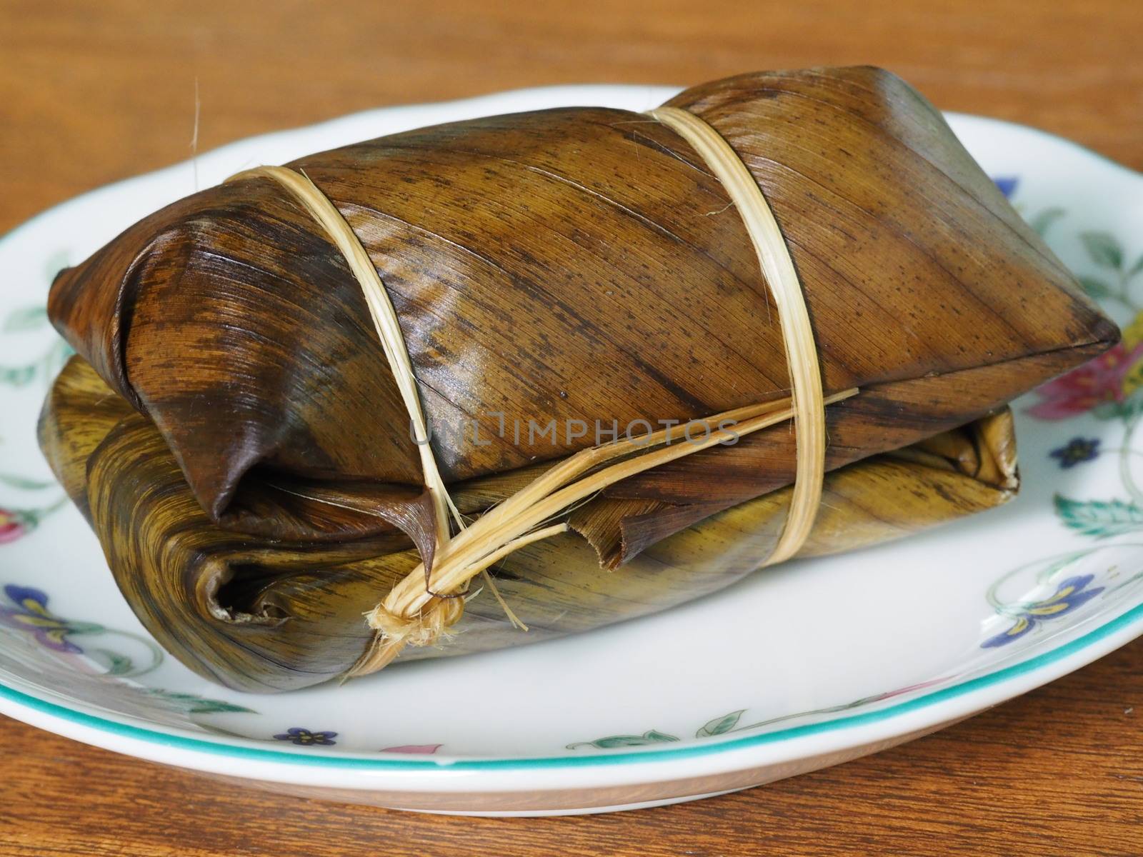 Bananas in Steamed Sticky Rice Covered With Banana Leaf, Traditional Thai Dessert Sweet Food Called Khao Tom Mad Khao Tom Pad