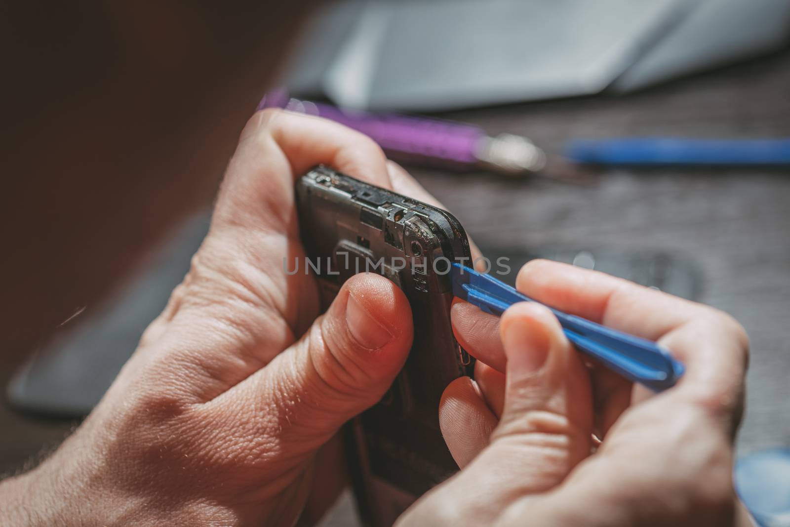 Man Repairing A Mobile phone by MilanMarkovic78
