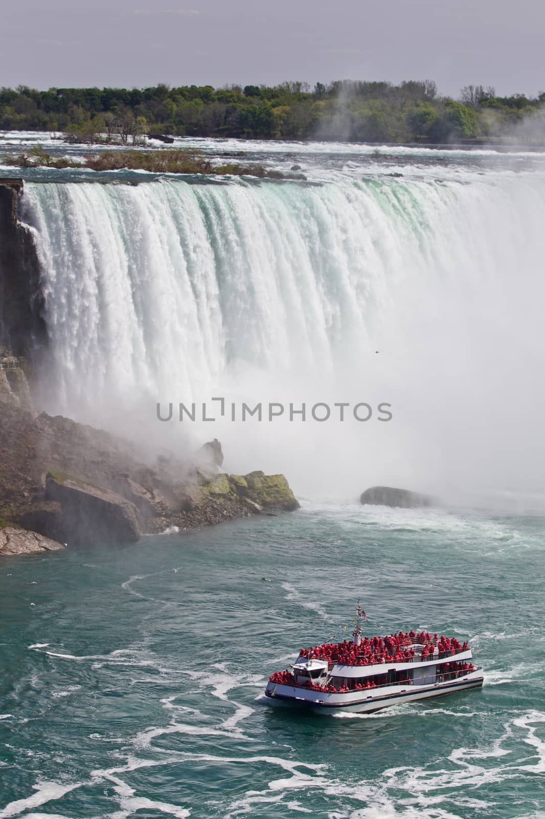 Beautiful isolated image of a ship and amazing Niagara waterfall by teo