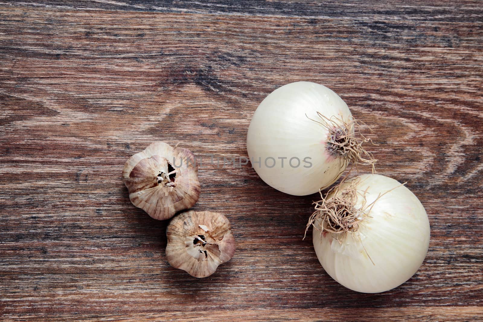 onion and garlic on wood. Top View on wooden table with Copy Space. Ingredients for cooking