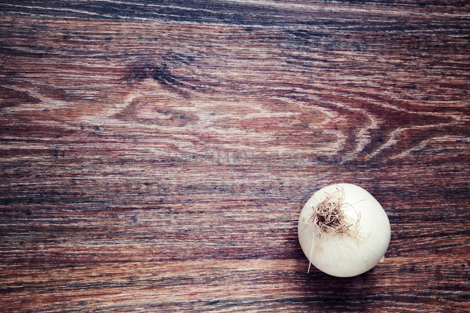 onion on wood. Top View on wooden table with Copy Space. Ingredients for cooking