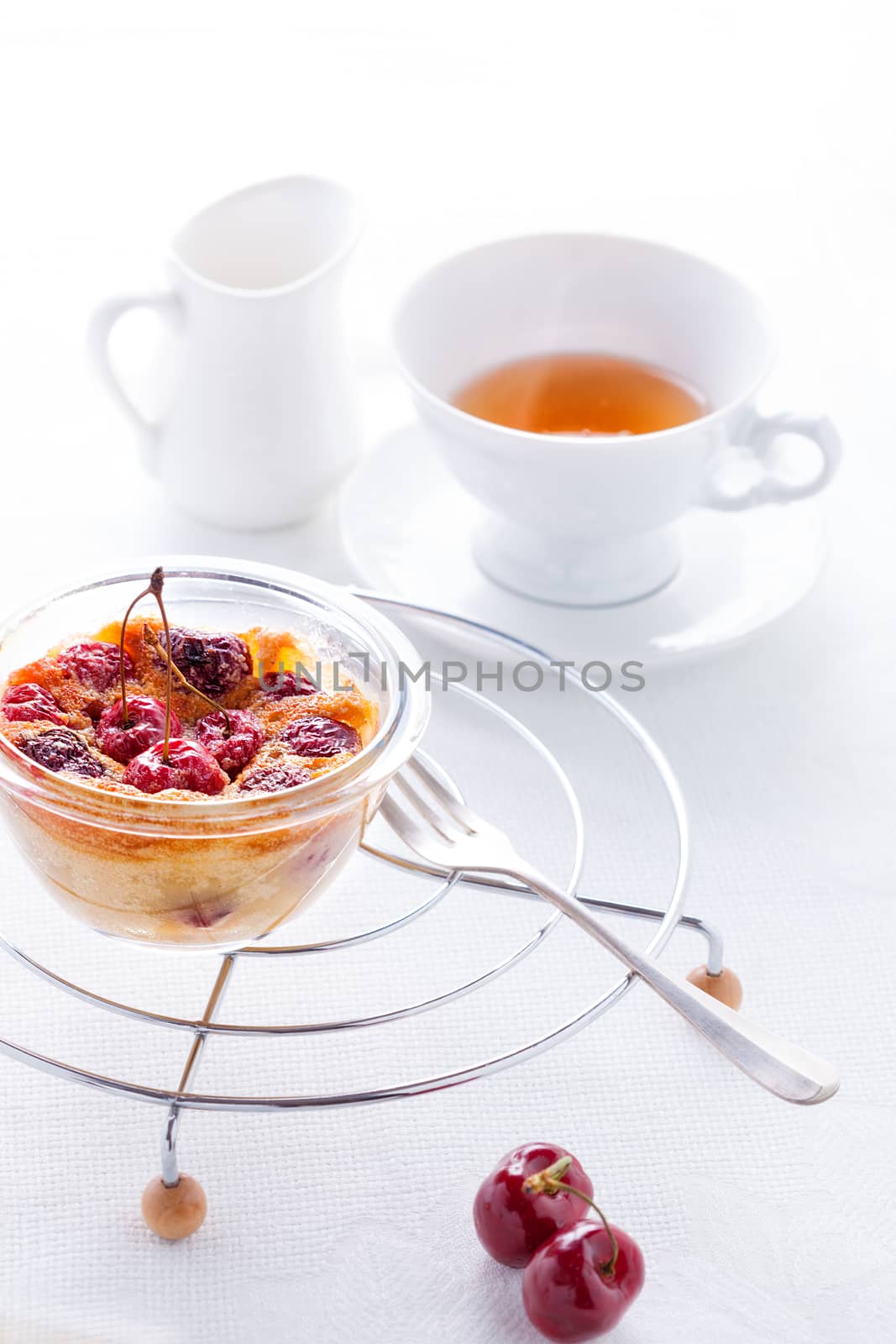 Clafoutis with berries and a cup of tea