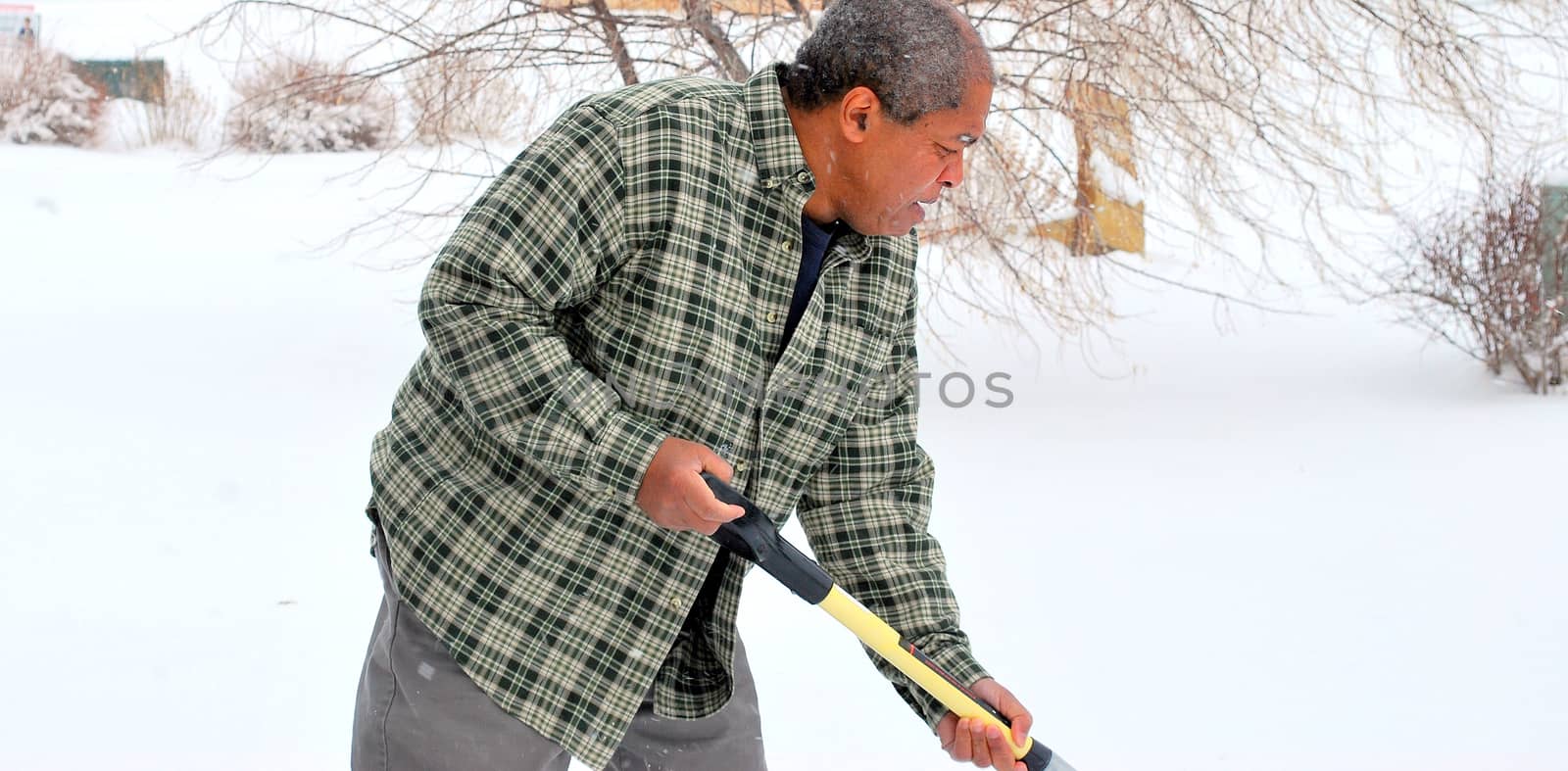 African american male in winter snow outdoors.