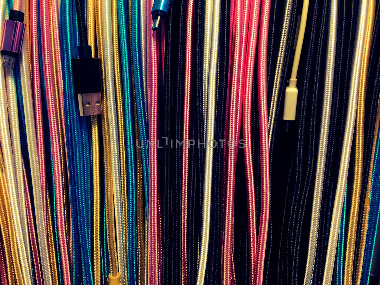 Various hanging  USB cable, lots of wires of different colors 