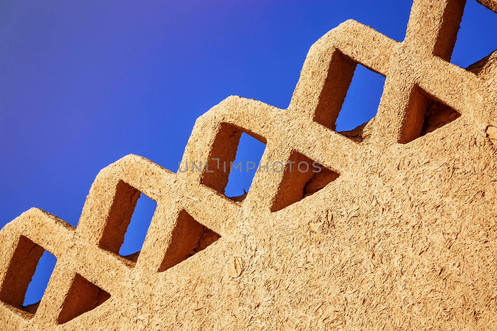 Rammed earth wall with beautiful blue sky