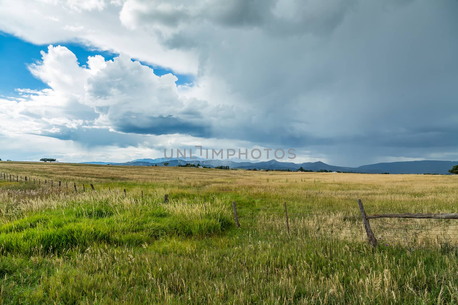A thunder storm approaches from the mountains along US Highway 160 in Colorado.