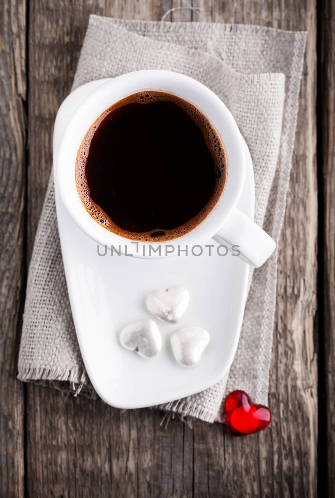 Cup of coffee served on a wooden surface by supercat67