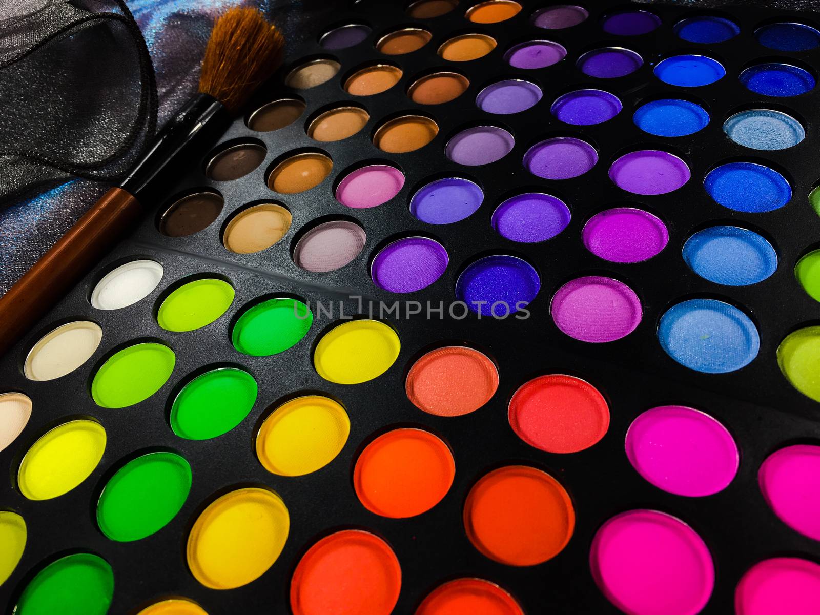 Fashion background  with Colorful makeup palette with makeup brush,color filter  