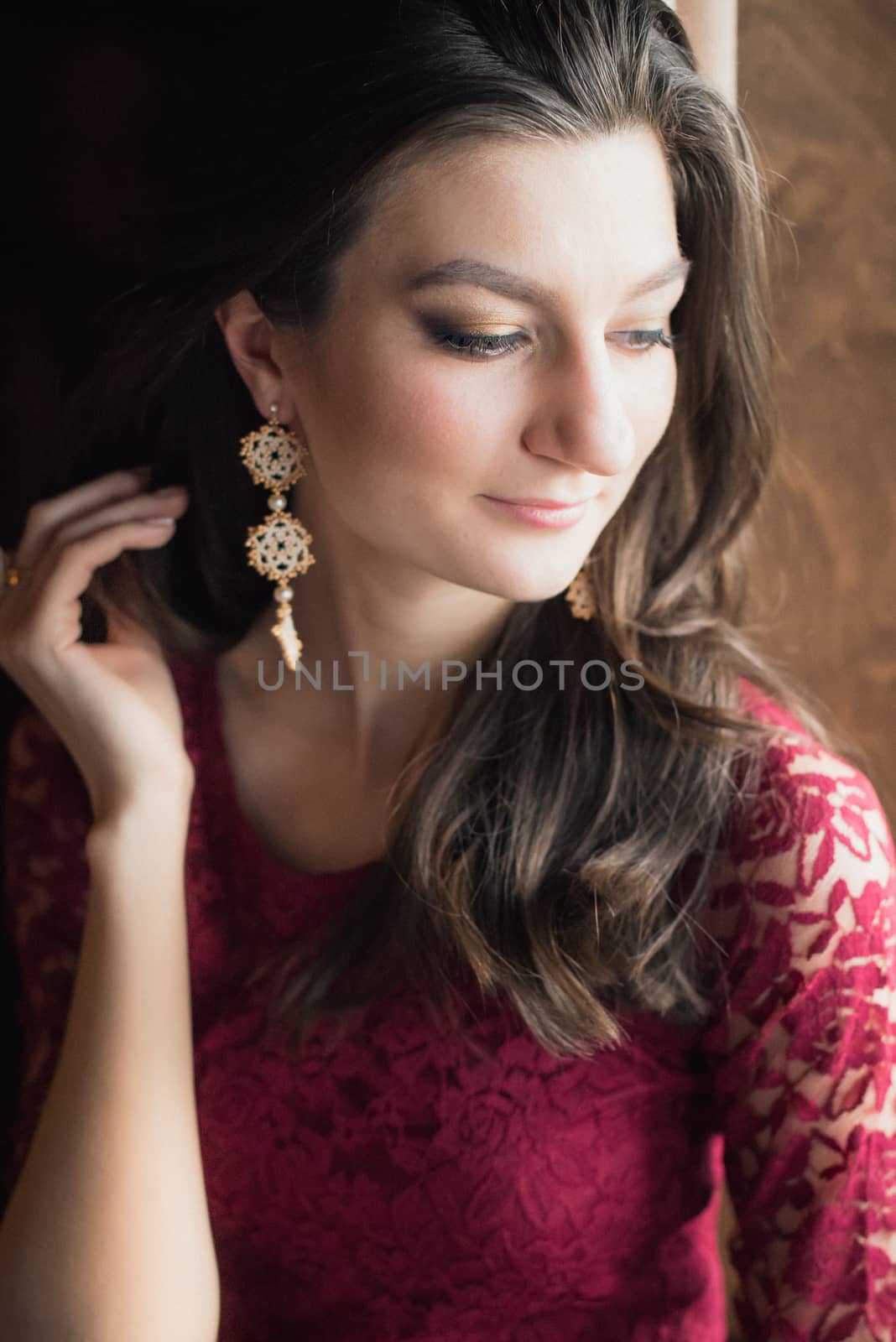 close-up portrait of a beautiful girl. She touching her hair