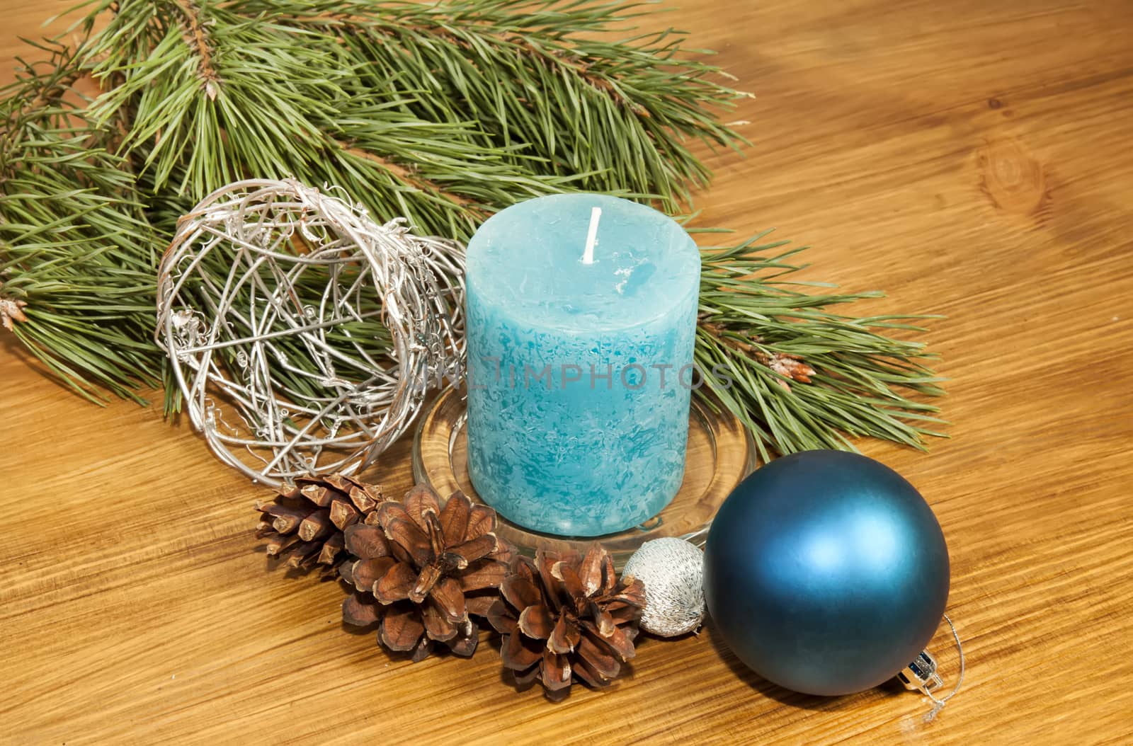 New Year 2017 composition with blue ball and candle on wooden background closeuo