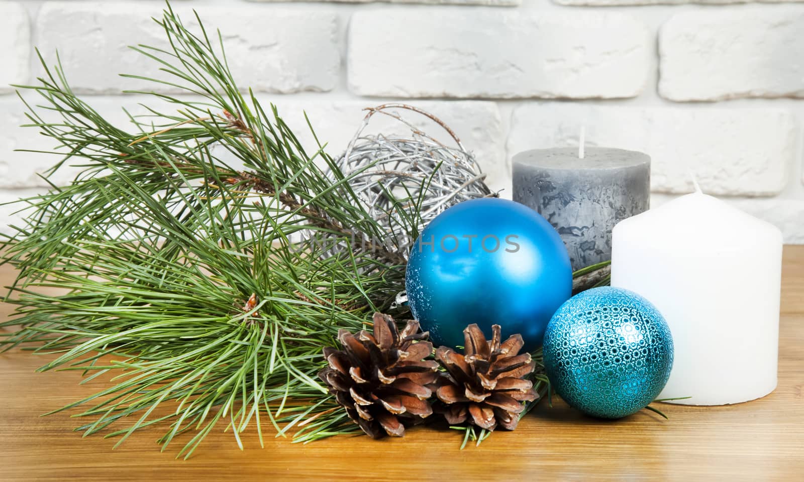 New Year 2017 composition with bright blue ball and white and grey candle 