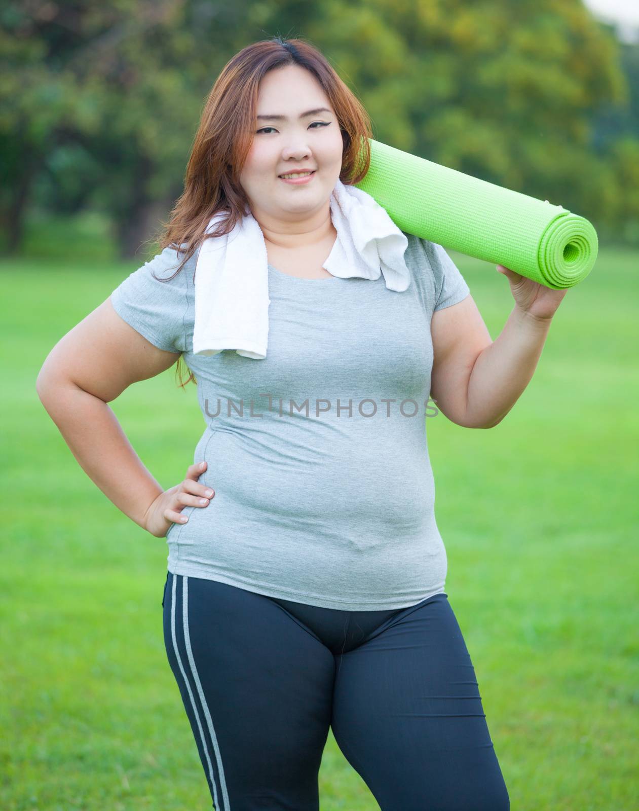 Pretty fat woman going to work out by witthaya