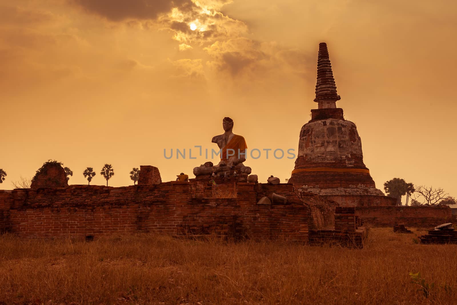 Thai temple sunset, the historical temple in Ayutthaya, Thailand by witthaya