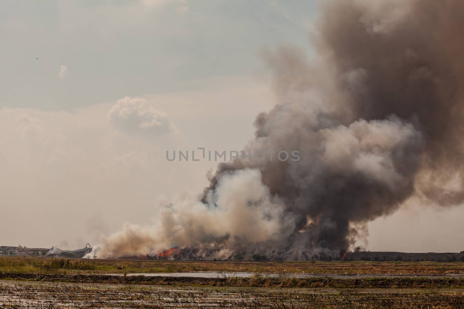 Burning garbage heap of smoke by witthaya