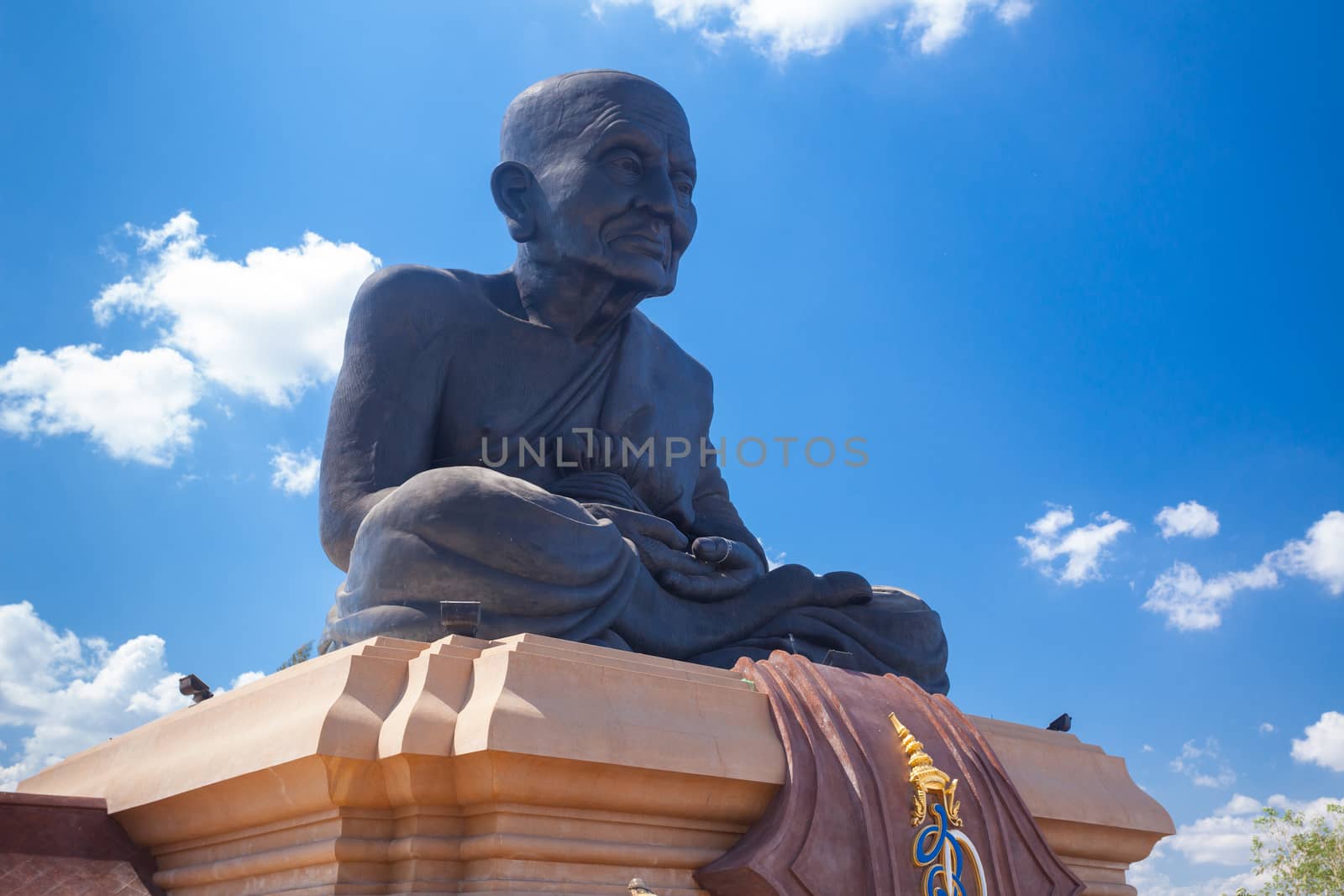 People worship around a Buddha statue around a big Buddha statue in Wat huay mongkol, Thailand