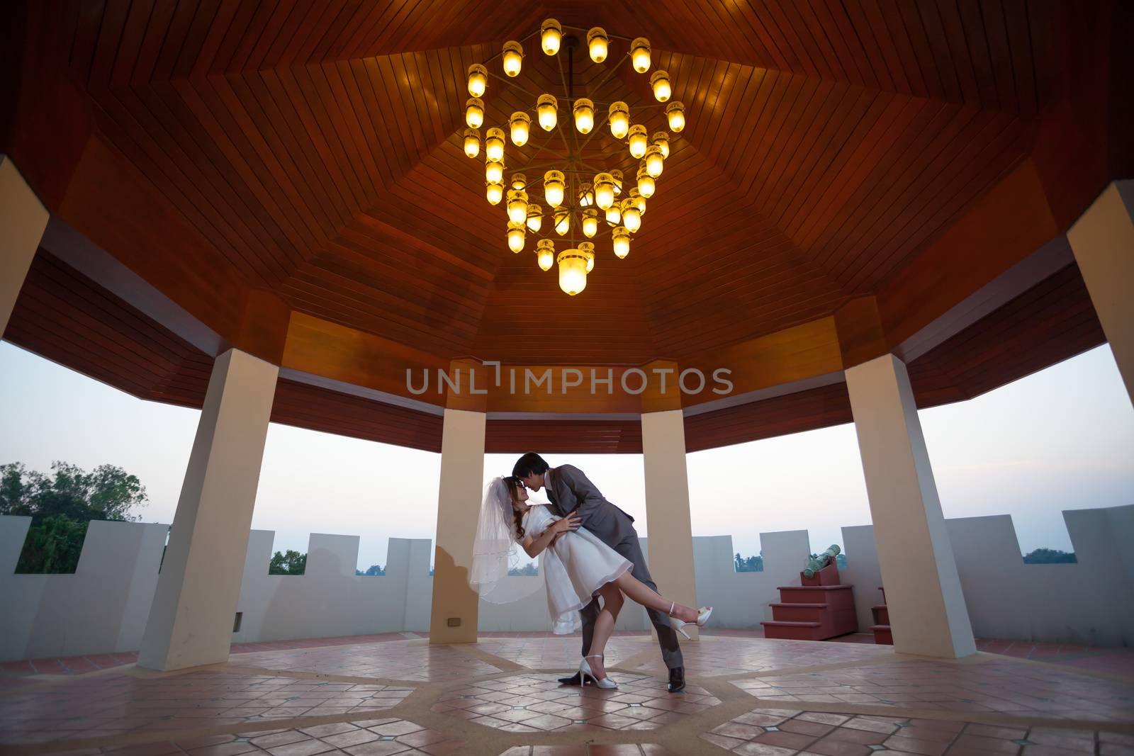 Loving asian couple with flower indoor