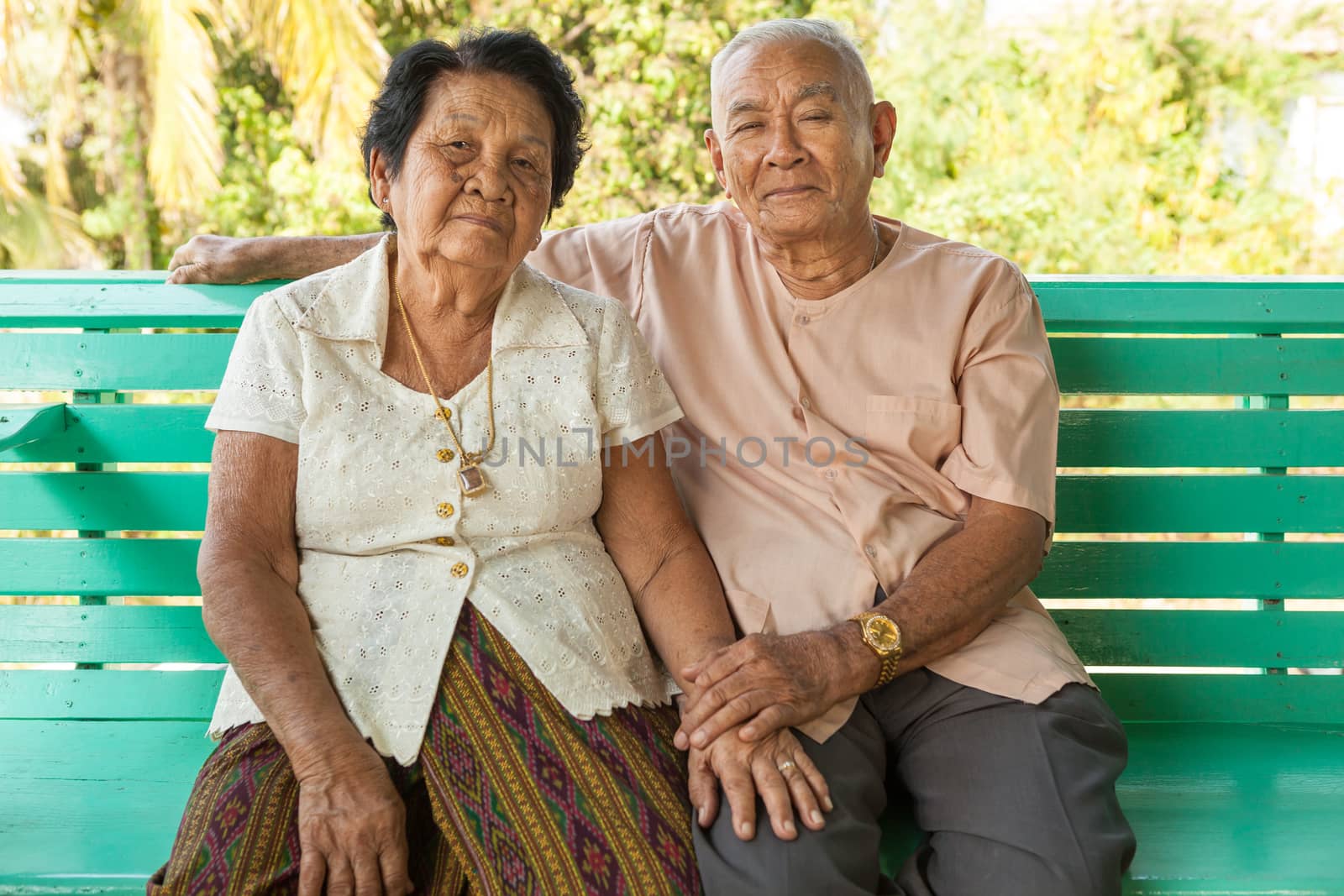 Happy Senior couple sitting indoor by witthaya