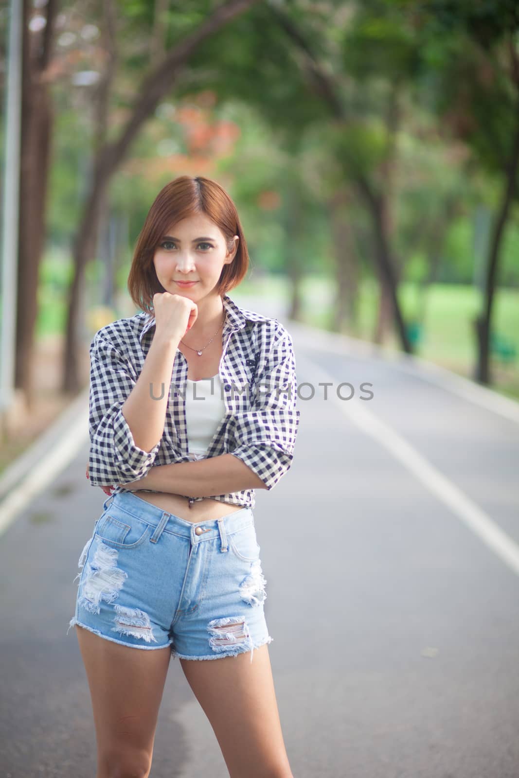 Portrait of beautiful asian woman in the park