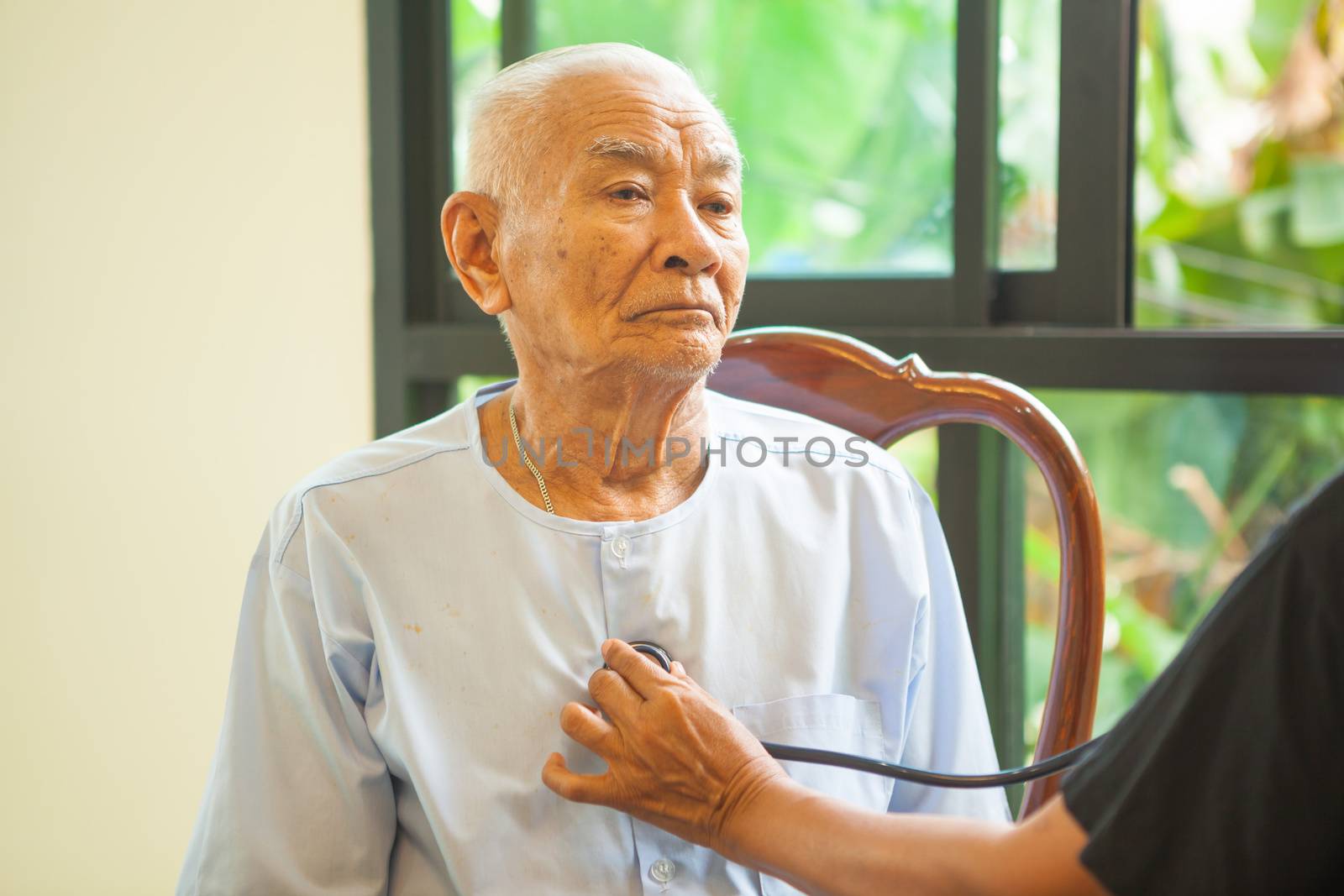 friendly doctor caring senior man indoor