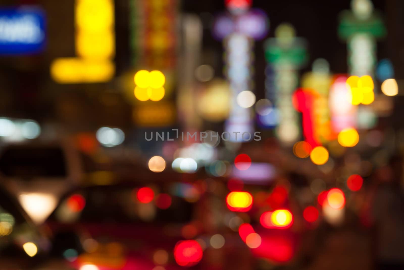 Blurred unfocused city view at night in Thailand