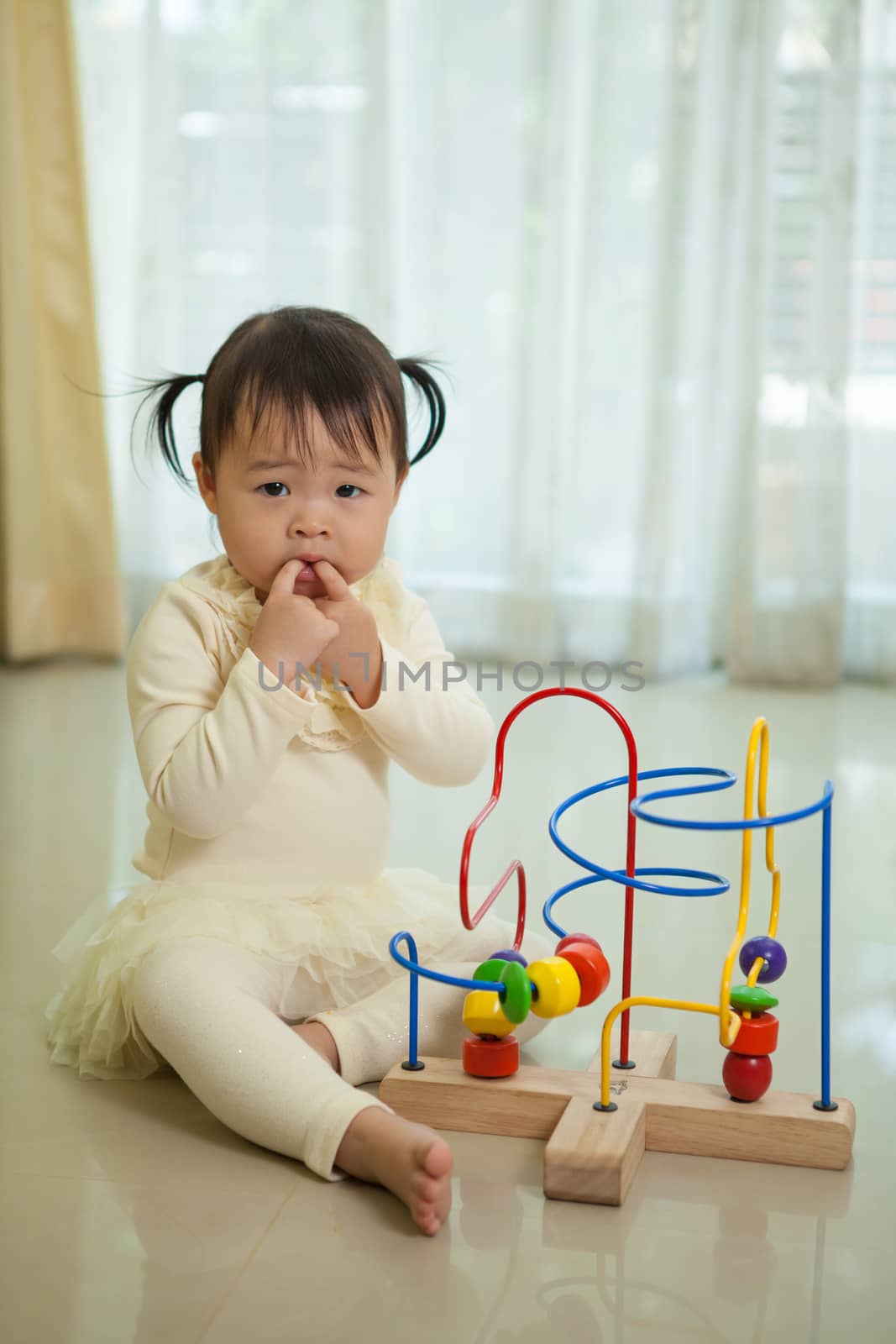Portrait of little asian girl in home