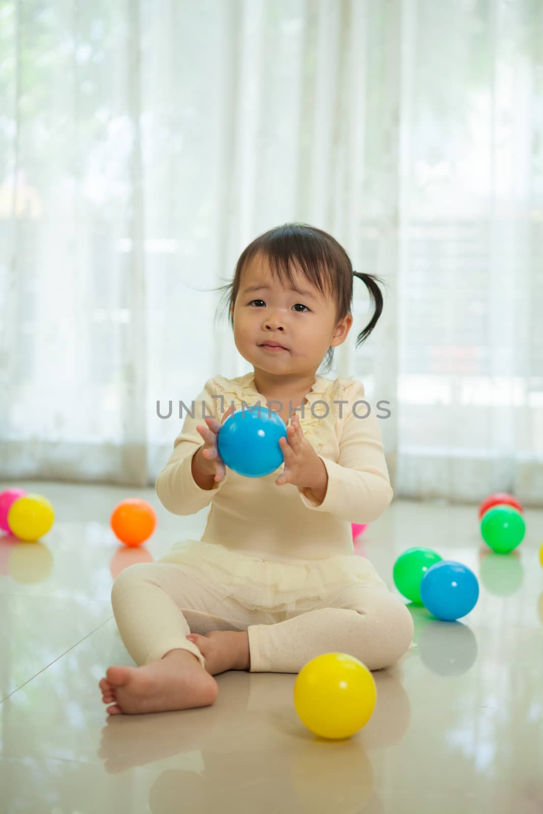 Portrait of little asian girl in home