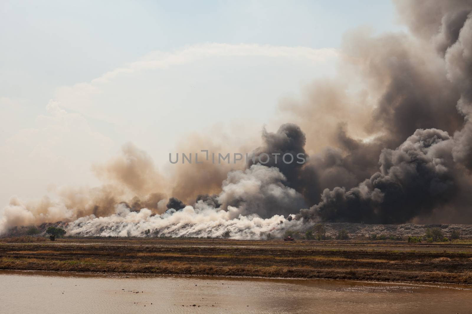 Burning garbage heap of smoke from a burning pile of garbage