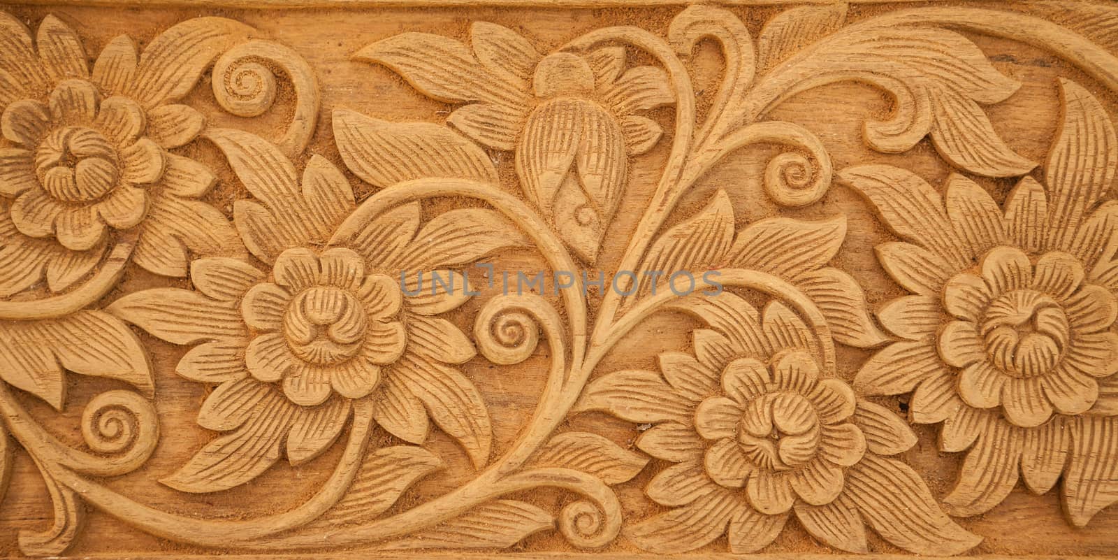 flower carved on wood by witthaya