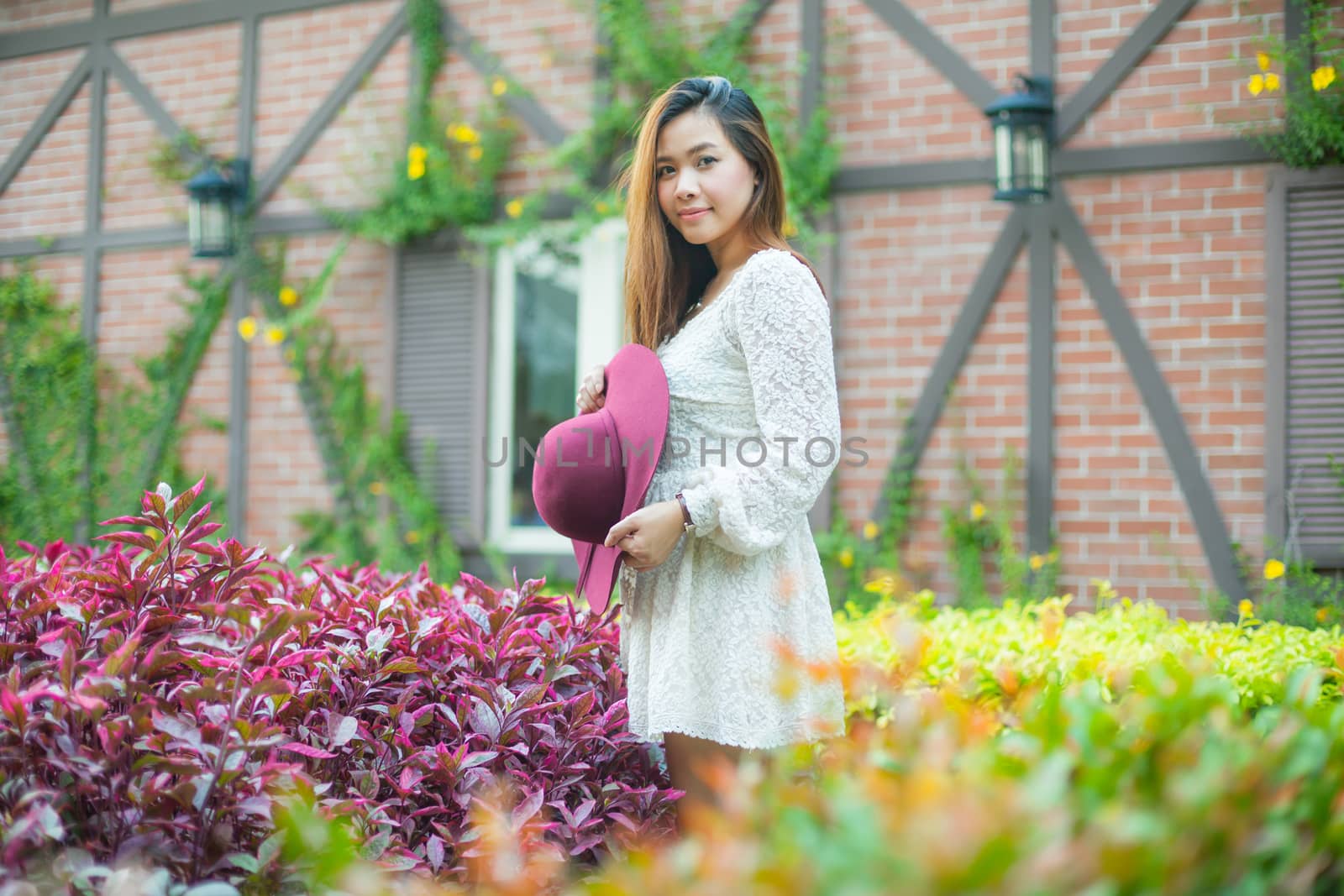 Beautiful young asian woman enjoying the freshness by witthaya