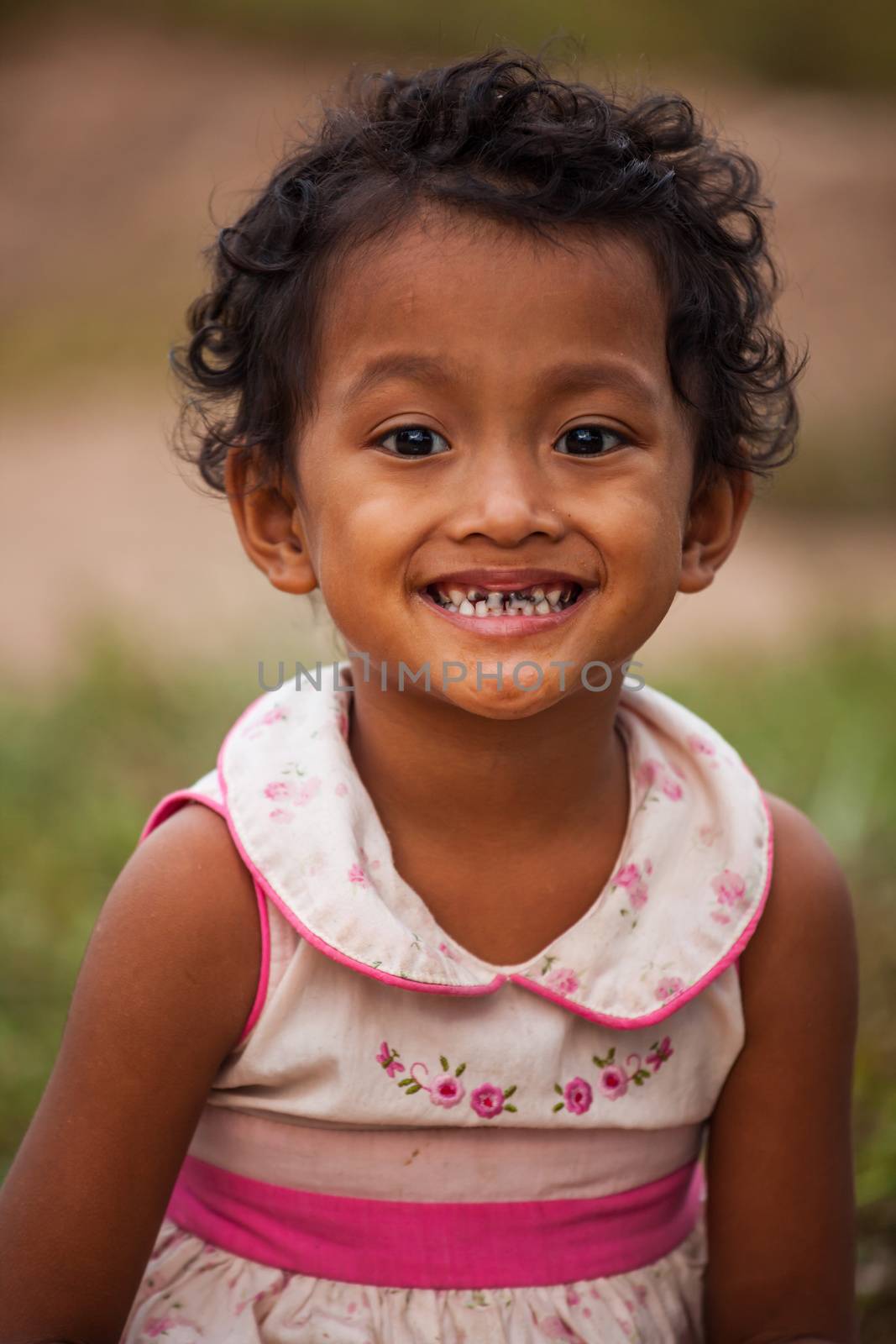 Portrait of smile asian poor girl in Thailand by witthaya