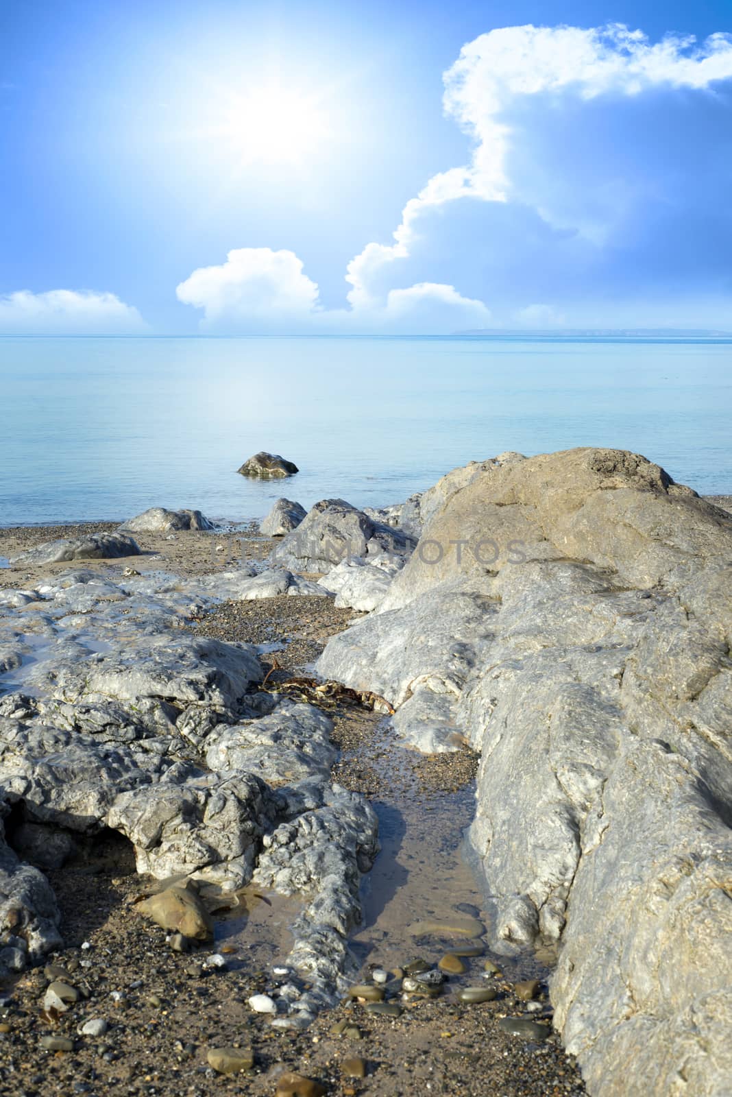 sunny day over the rocks by morrbyte