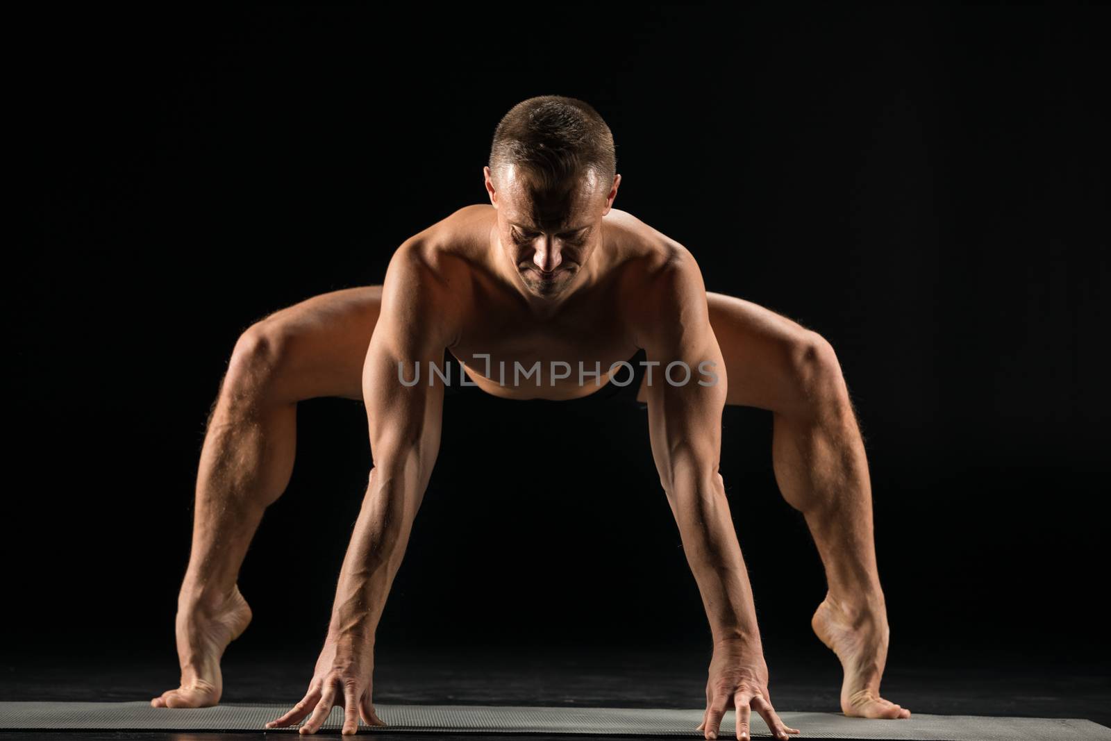 Man standing in yoga position by LightFieldStudios