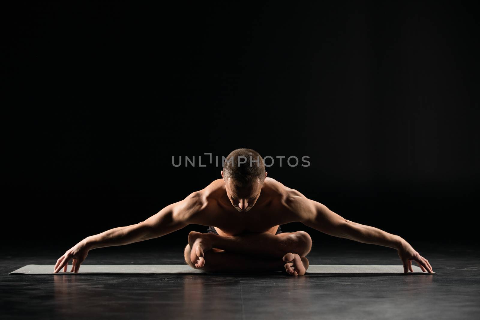 Man sitting in lotus position  by LightFieldStudios