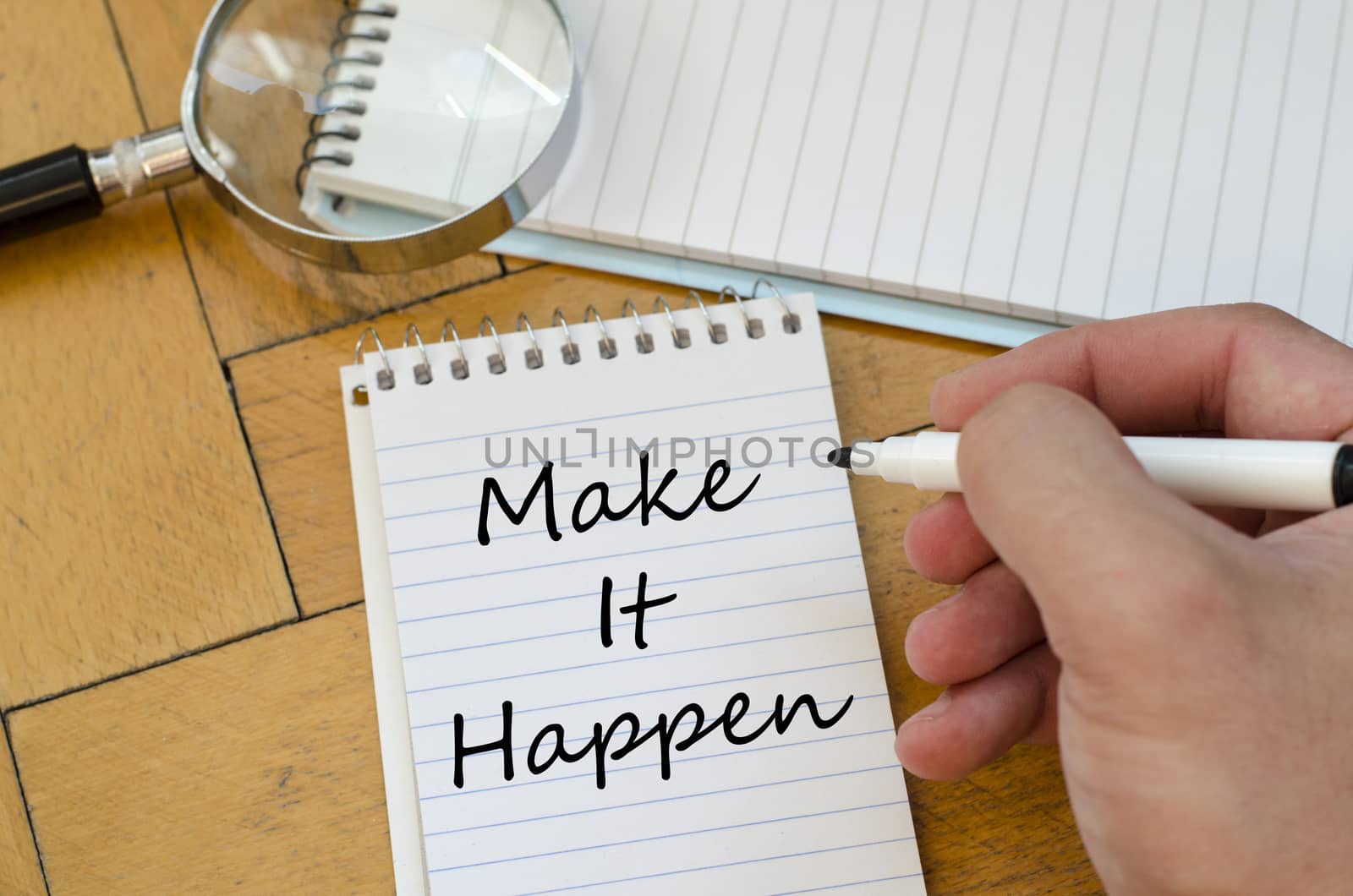 Make it happen concept on notebook by eenevski