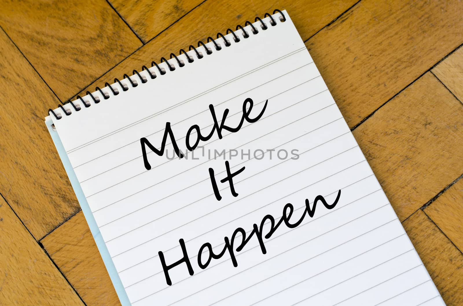 Make it happen text concept write on notebook
