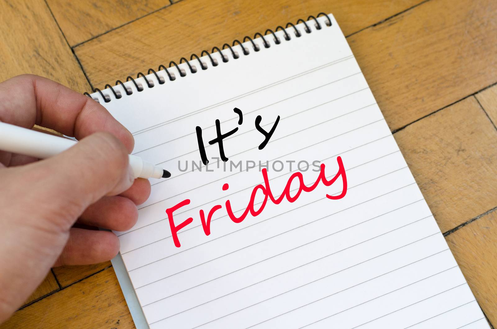 It's friday text concept write on notebook