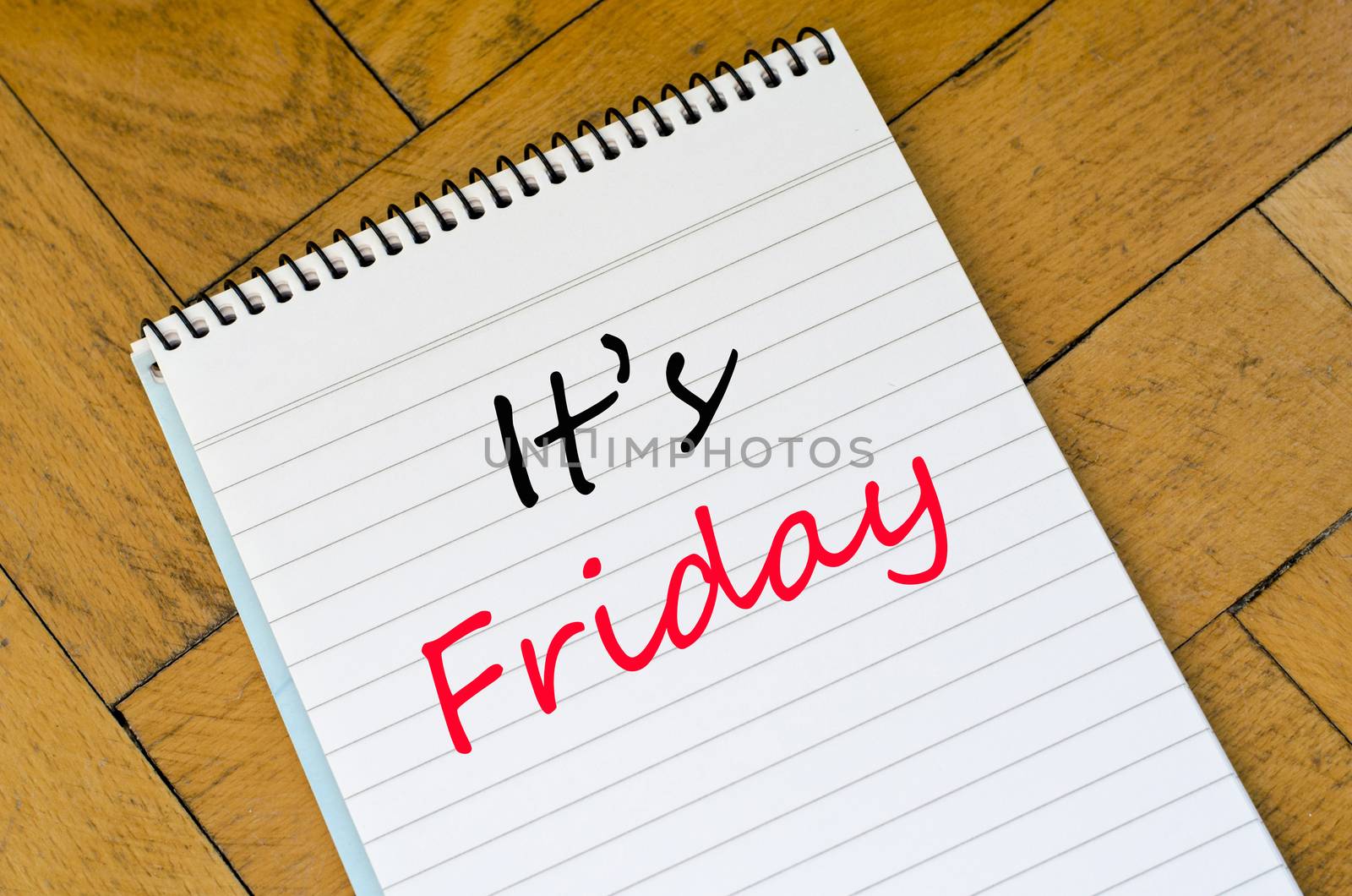 It's friday text concept write on notebook