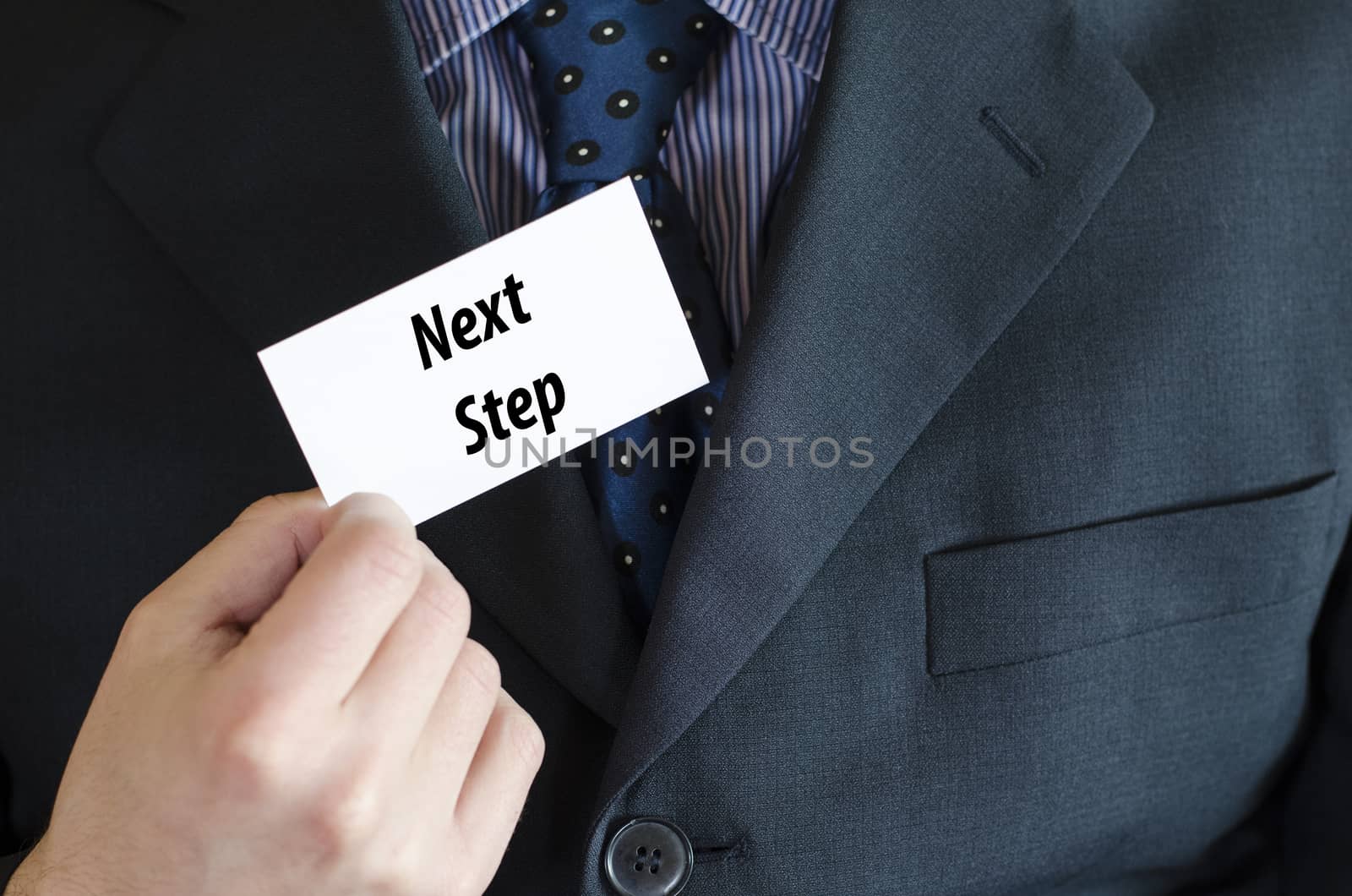 Next step text note concept over businessman background