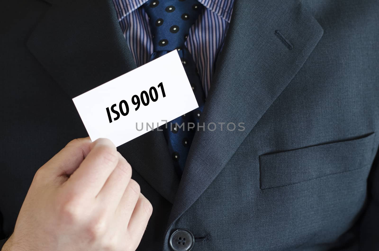 Iso 9001 text note concept over businessman background
