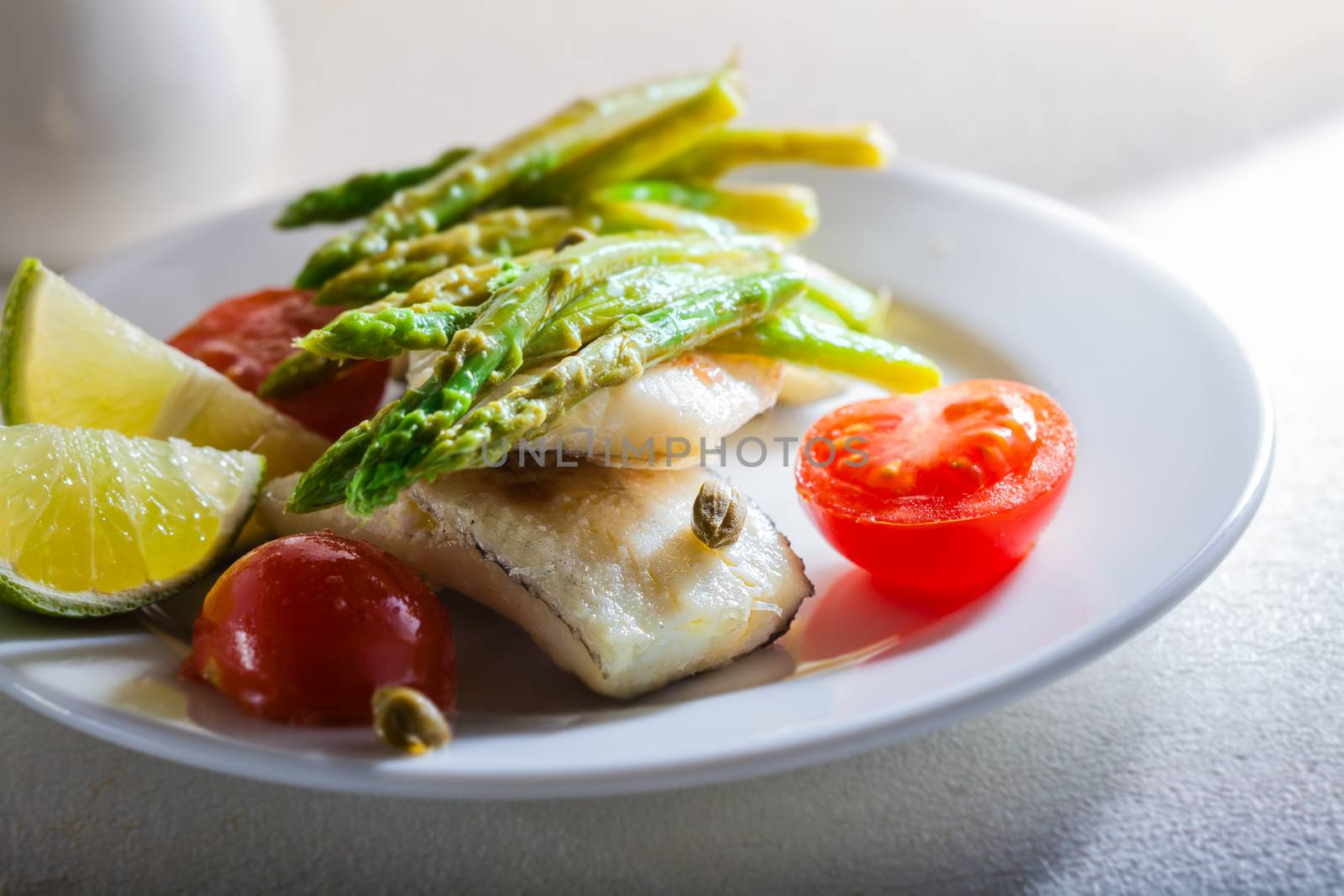 Mackerel fillets with asparagus lemon and tomato