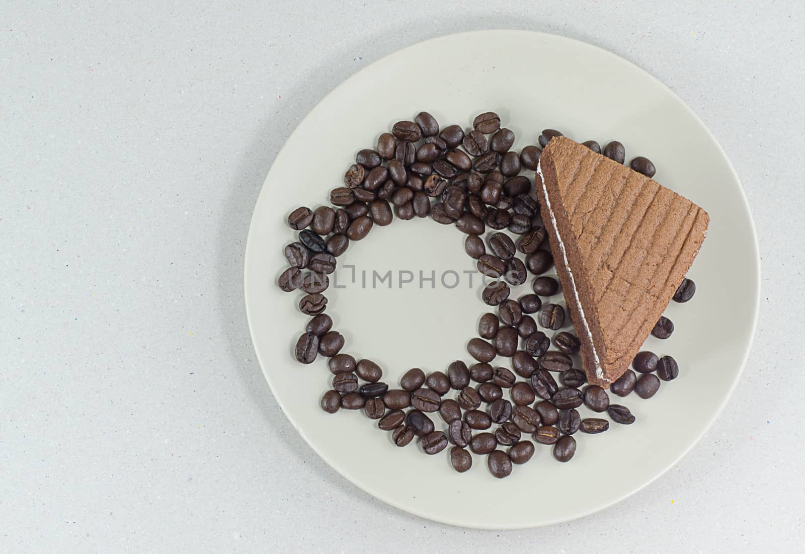 coffee bean with slice of chocolate cake on White background