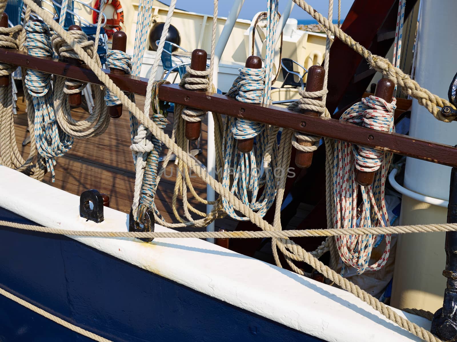 Old traditional wooden sailing boat sails and rigging on sea