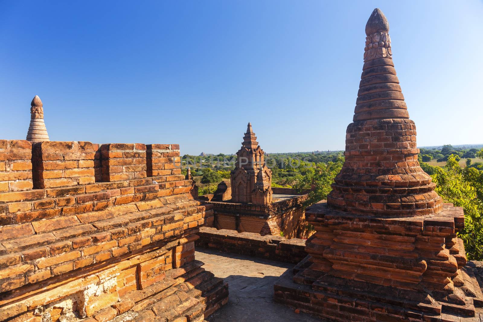 Bagan buddha tower at day by cozyta