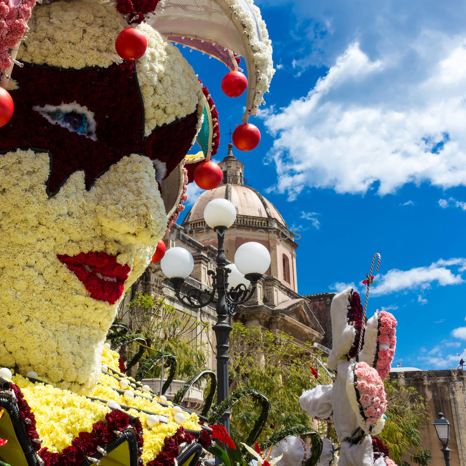 flowered mask with carnations and roses to celebrate the Sicilian spring