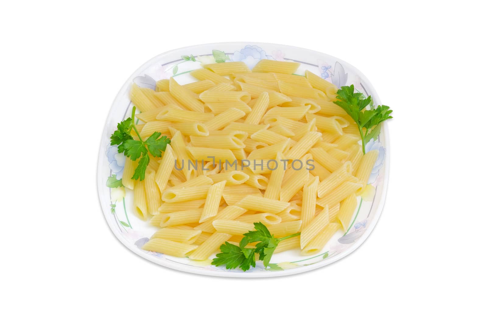 Cooked cylinder-shaped pasta decorated with a small parsley twigs on a dish on a light background
