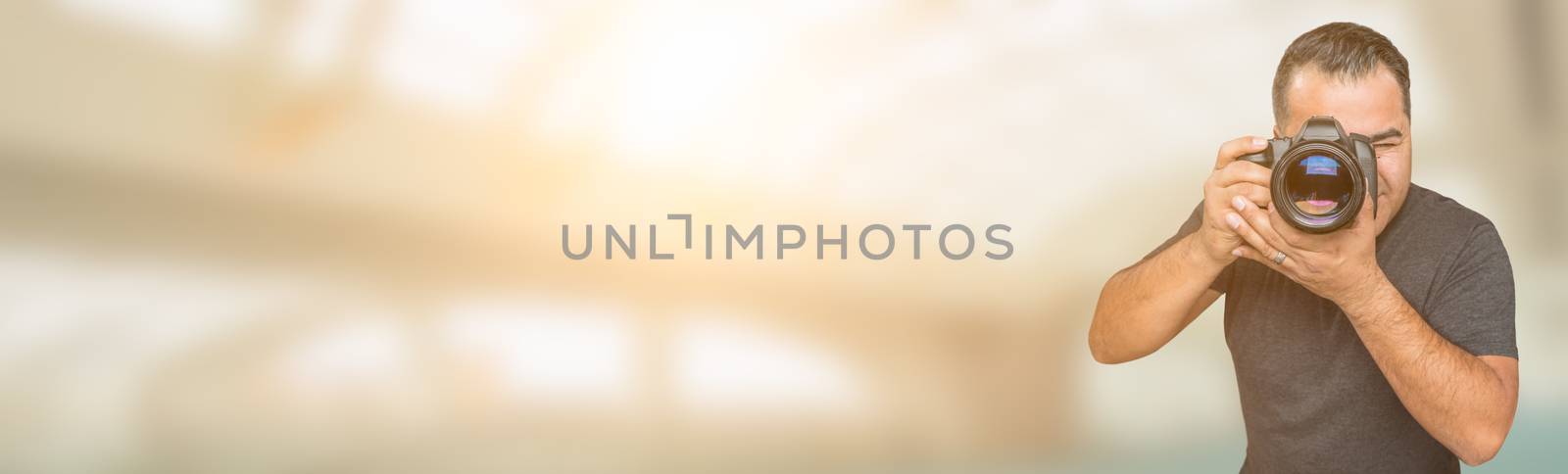 Hispanic Man with DSLR Camera Wide Banner with Room For Copy.