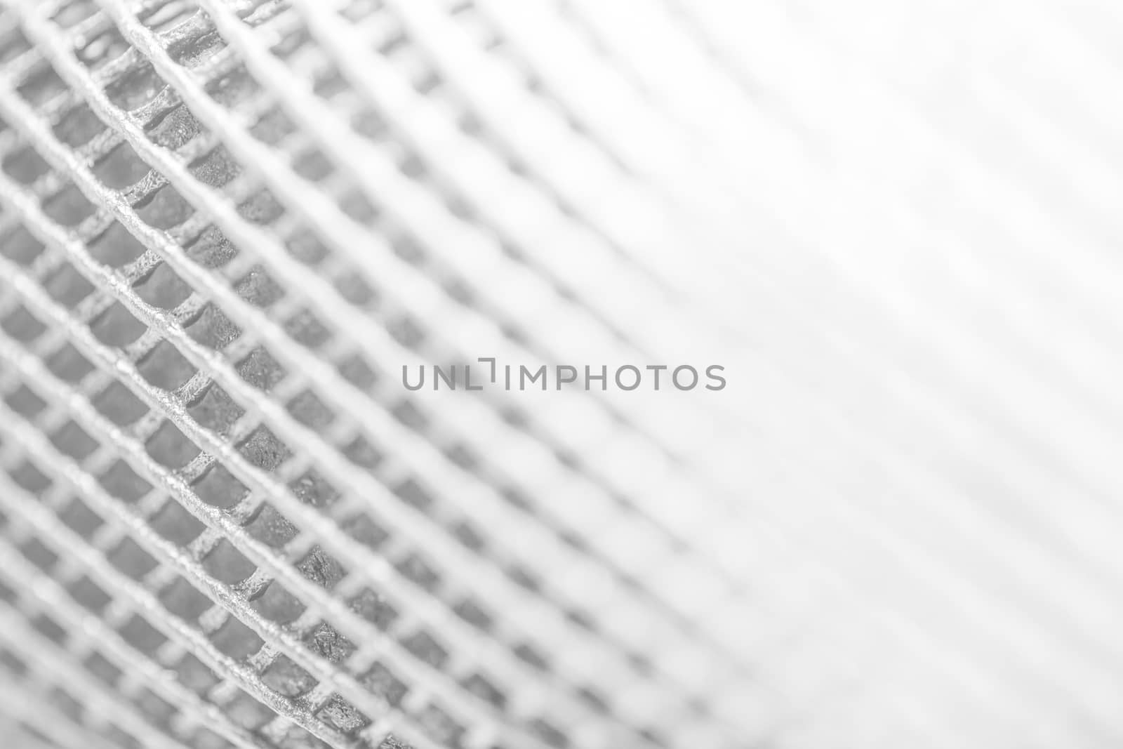 Abstract white background of grunged grid metal