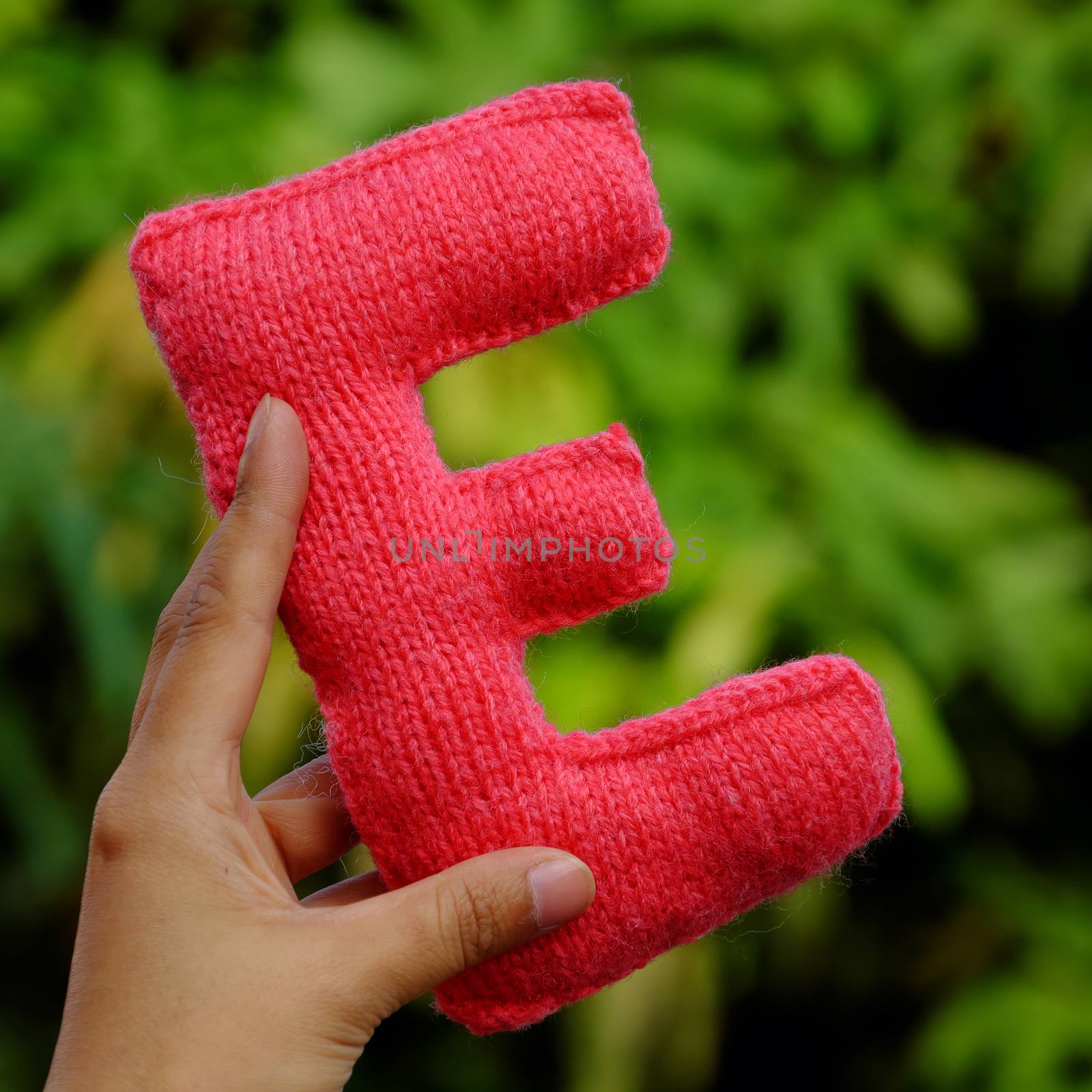 Woman hand pick knitted alphabet by xuanhuongho